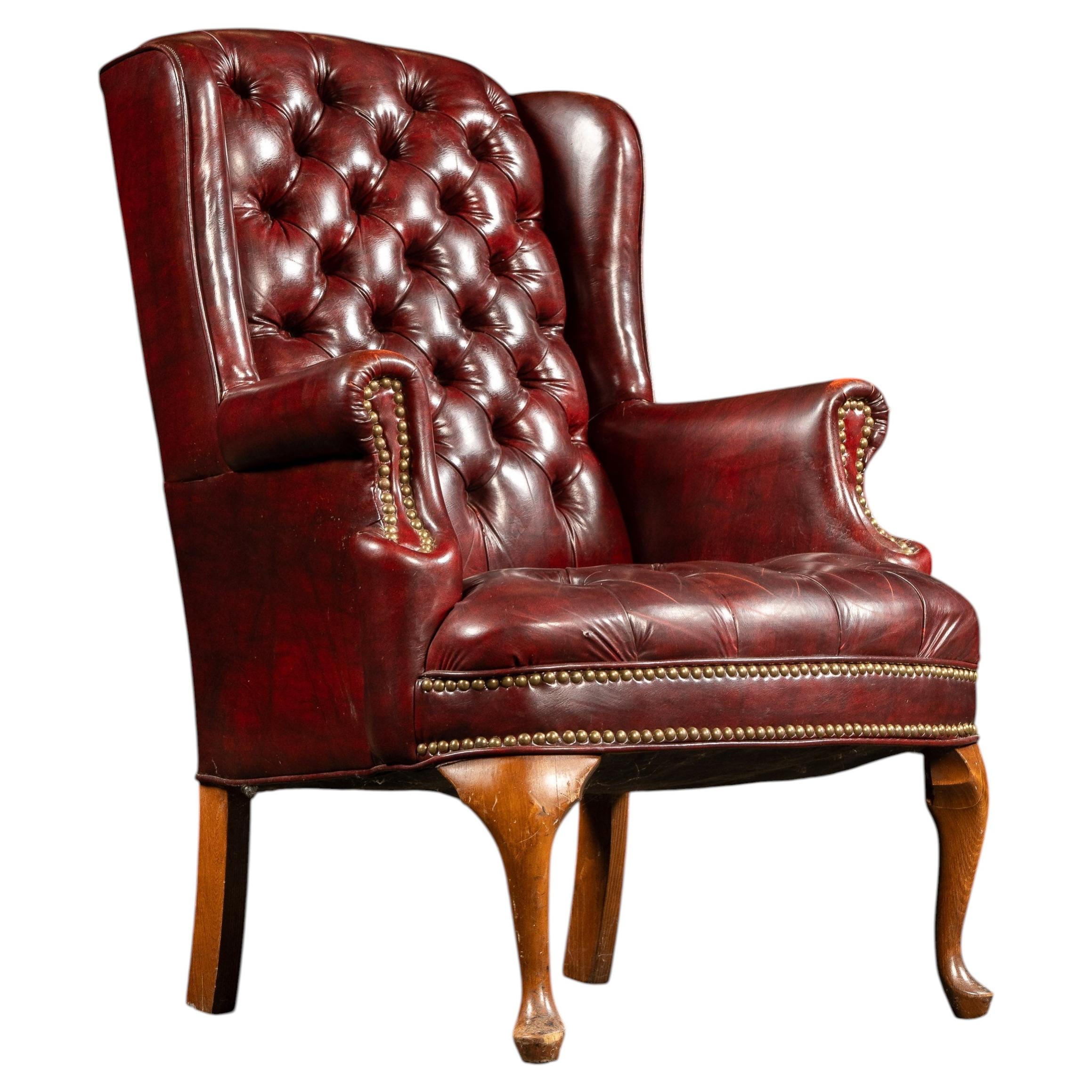 Vintage Tufted Leather Wingback Chesterfield Armchair in Oxblood For Sale