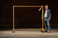 Vintage Industrial Rolling Cast Iron Pipe-Frame Garment Rack in Yellow