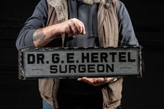 Antique "Dr. G.E. Hertel, Surgeon" Foil-Backed Scalloped-Edged Glass Sign