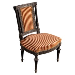 Silla auxiliar de estilo neorrenacentista del siglo XIX, de madera maciza ebonizada