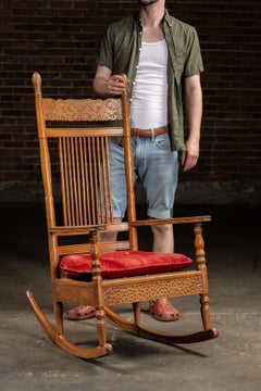 Antique Wooden Rocking Chair with Red Cushion