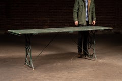 Weathered Green Farmhouse Trestle Table with Cast Iron Base
