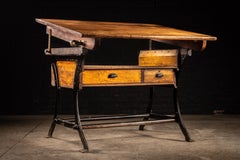 Table à dessin industrielle en bois du début du XXe siècle, avec socle en fonte