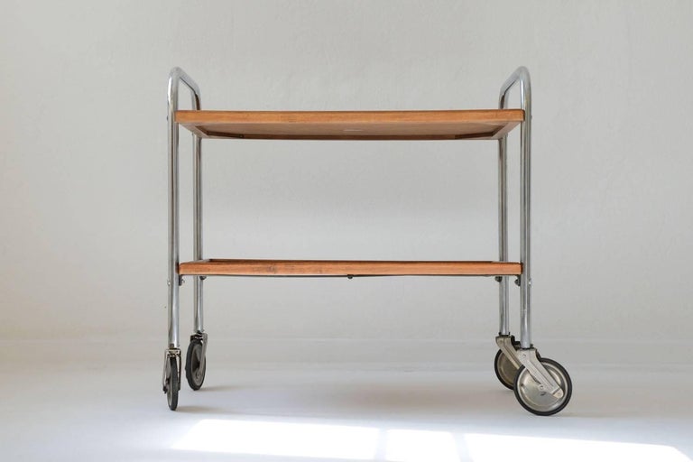 Very rare bar cart designed by Jacques Hitier and manufactured by Tubauto in the early 1950s. First used on cruise ships,
it was also presented at the Salon des arts menagers in 1954

The bar cart has a suspension system.

Reference: Jacques