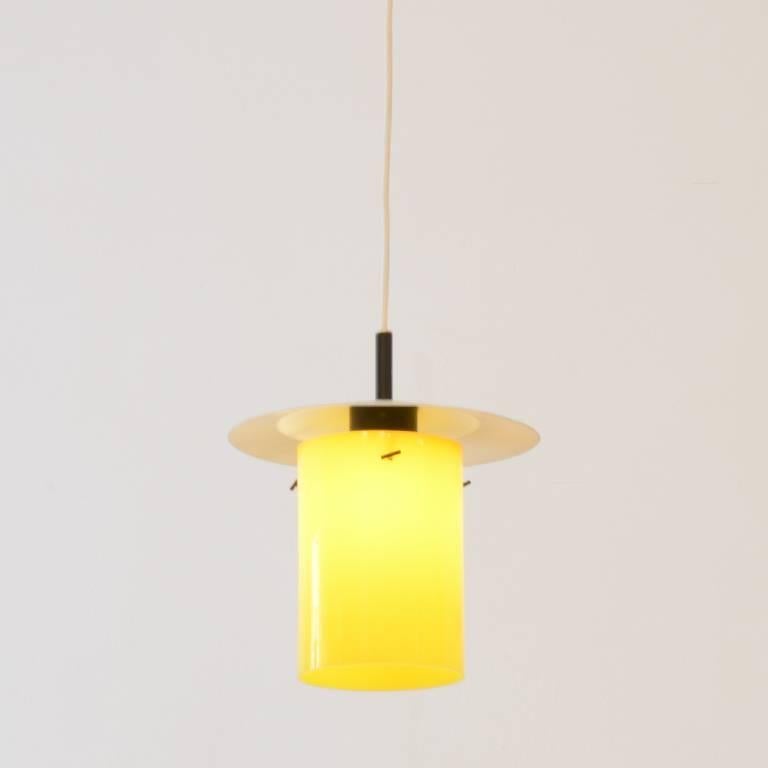 Very rare pendant designed by Hans-Agne Jacobsson for Markaryd in yellow Perspex.

The height of the pendant can be adjusted with the wooden cable holder.