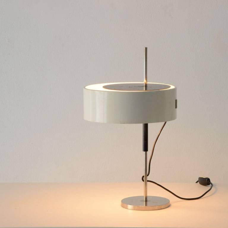 Minimalistic table lamp Model 243 designed by Angelo Ostuni and Renato Forti, circa 1955 for O-Luce, Milano.

Shade is steplessly adjustable and can be swiveled.