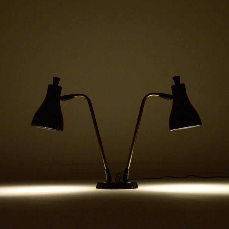 Beautiful double cone desk lamp designed by Gerald Thurston for Lightolier.

Shades can be moved in all directions.