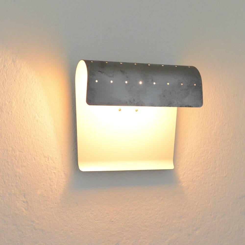 Very nice wall light model 212 designed by Jacques Biny and manufactured by his company Luminalite.