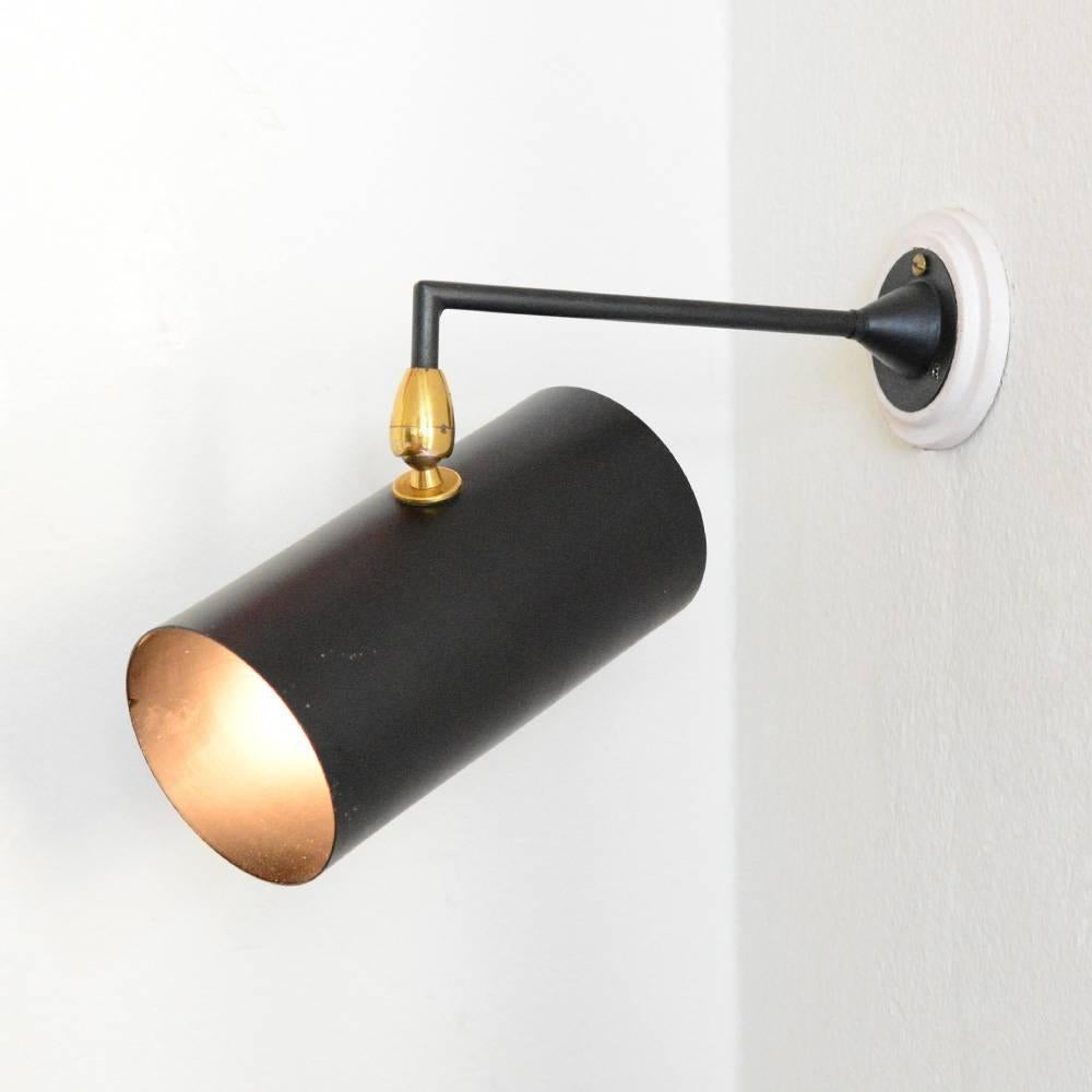 Black Spot by Serge Mouille called Tuyau Moyen.
Can be used as a wall light as well as a ceiling fixture
Shade can be rotated in all directions.