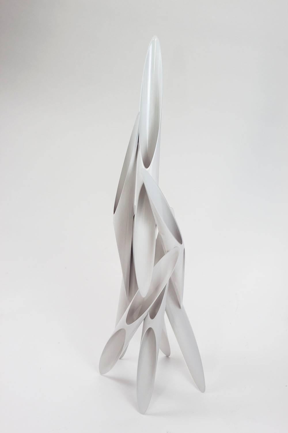 Biased sliced aluminium tubes painted white. A larger scale version of 