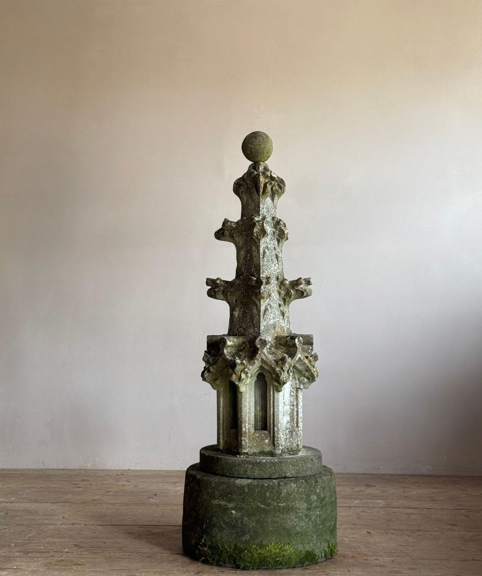 A carved limestone crocketed spire or finial section. The stepped base is added, as is the ball to the top. English 18thC Dimensions: H 115cm W 34cm