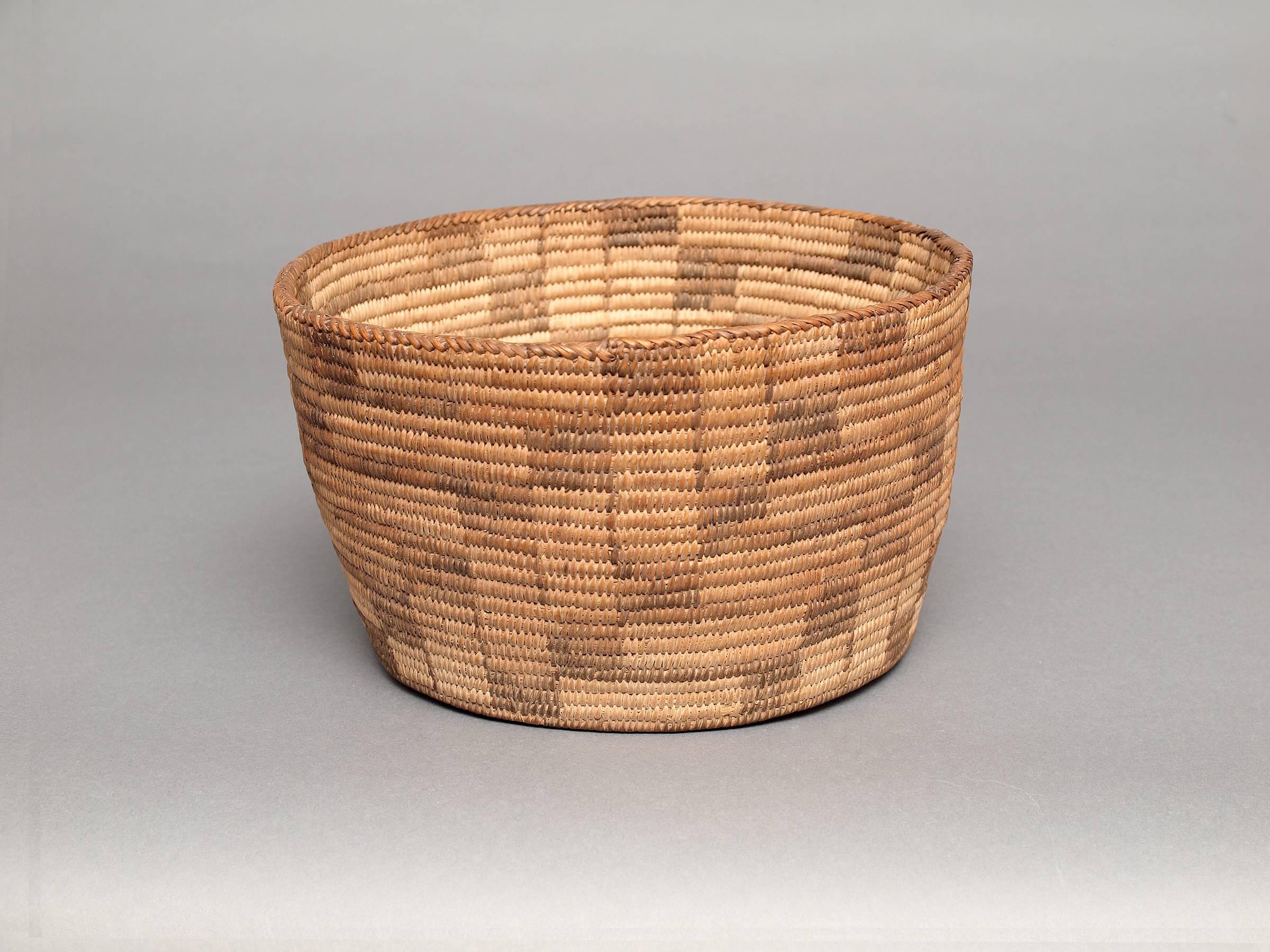 This Tohono O'odham bowl was created in the early part of the 20th century and was expertly woven of natural fibers. 

Expedited and International Shipping is available; please contact us for an estimate.