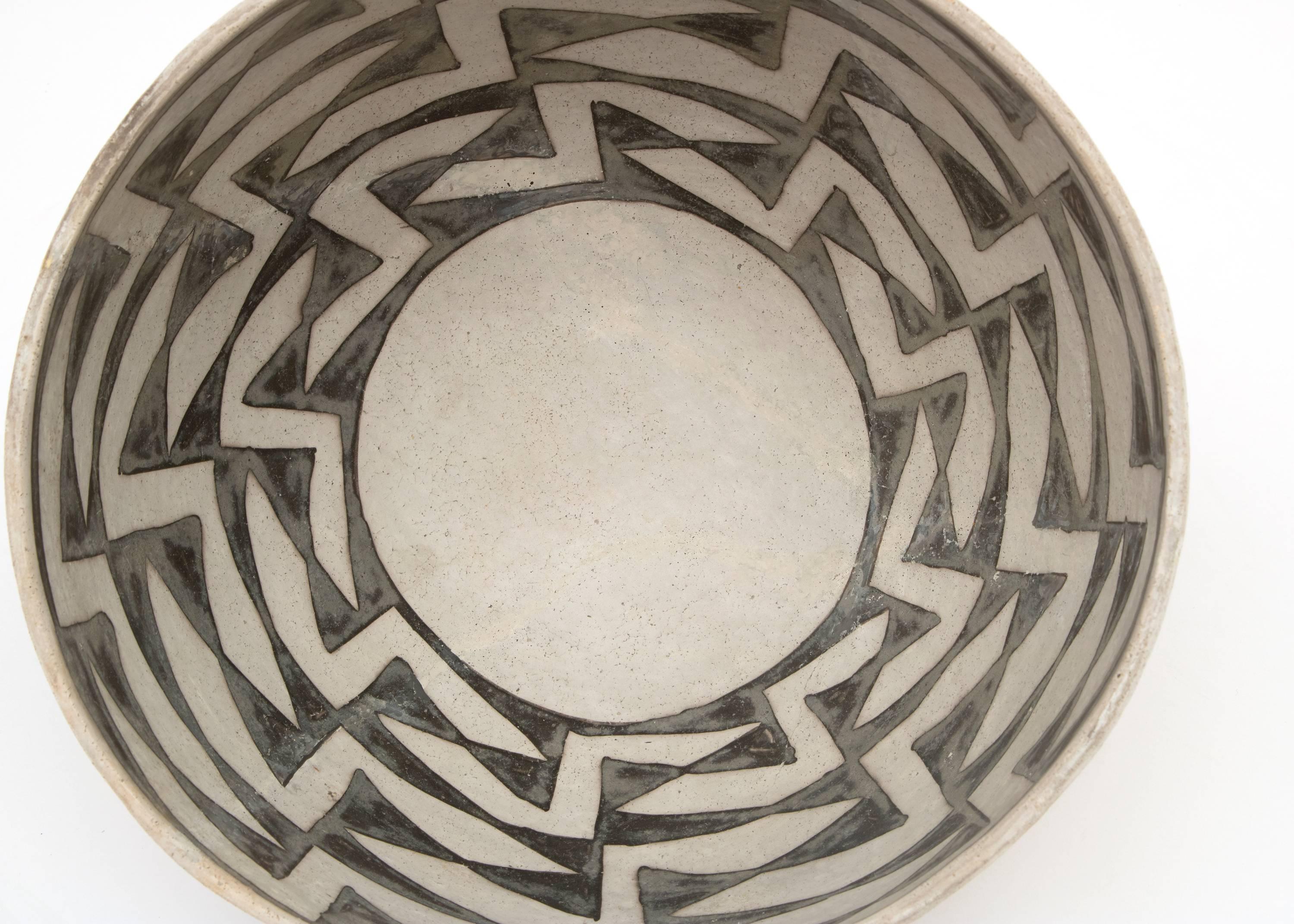 An Anasazi black-on-white earthenware bowl finely painted with slip glazes in a geometric pattern. 

The Anasazi people lived in the American Southwest in what is now the four corners region (where present-day Colorado, Utah, New Mexico and