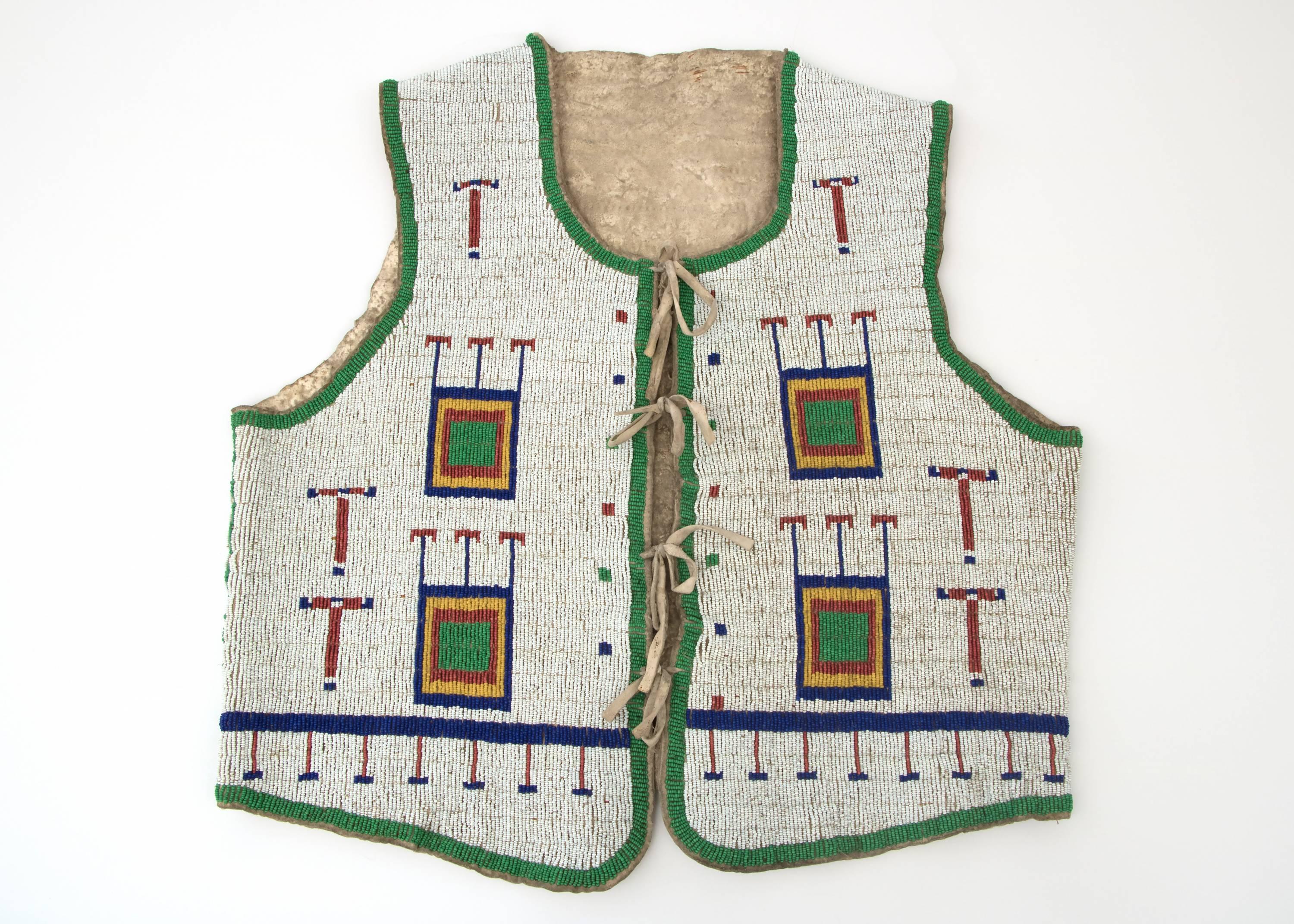 A Lakota Sioux (Plains Indian) vest constructed of native tanned hide with trade beads. Fully beaded with geometric and pictorial elements including crosses.

A Nomadic tribe, the Sioux are associated with areas of the great plains of the United