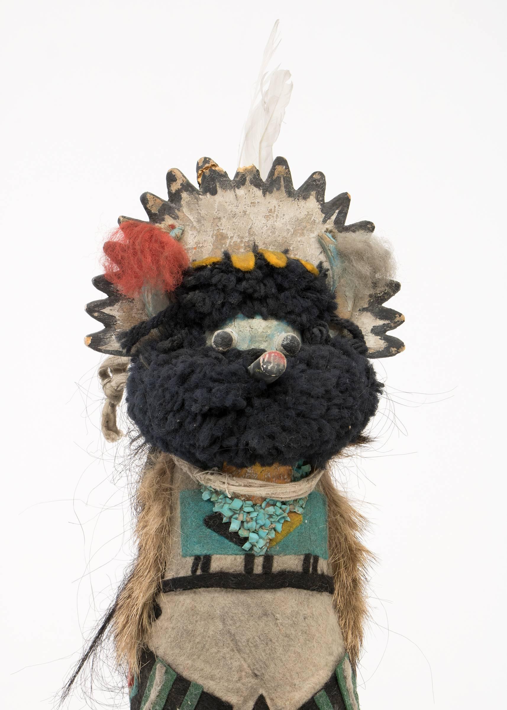 Native American Kachina (Katsina) doll made of cottonwood with a felt costume from the early 20th century. The doll represents a Shalako dancer. During the Shalako Festival, which is held in early winter, dancers representing the couriers of the