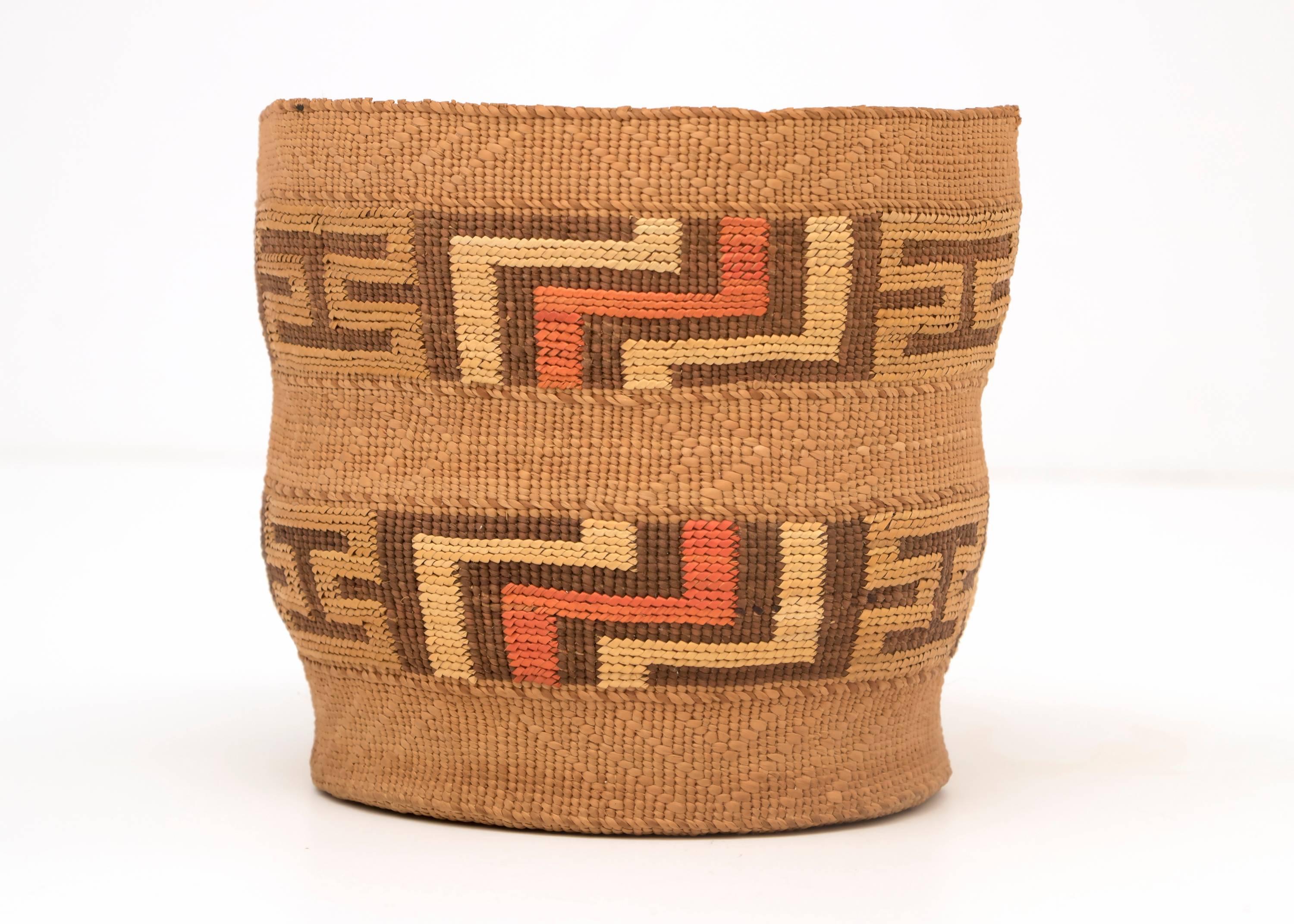 A flat bottomed cylindrical berry basket with a very fine weave with Classic Tlingit geometric false embroidery designs.

The Tlingit peoples are indigenous to the Pacific Northwest Coast; inhabiting southeastern Alaska, portions of British