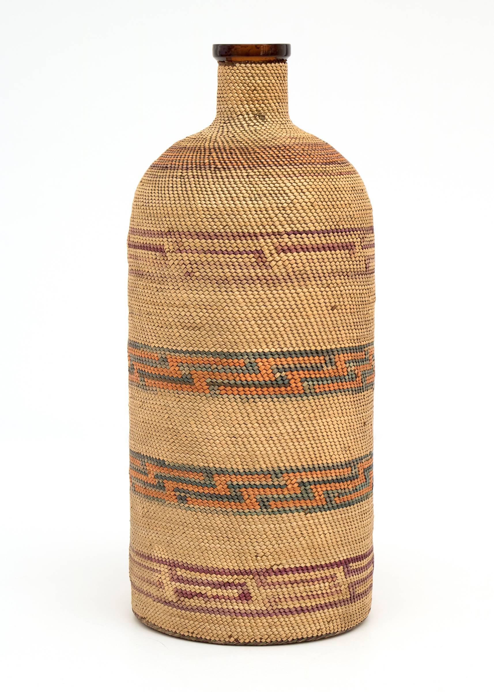 A bottle overlaid with intricate weaving by a member of the Micmac (Mi'kmaq or Míkmaq) tribe.

The Micmac are original natives of the Northeastern Woodlands of the United States and Canada including present-day New Brunswick or Nova Scotia, Quebec,