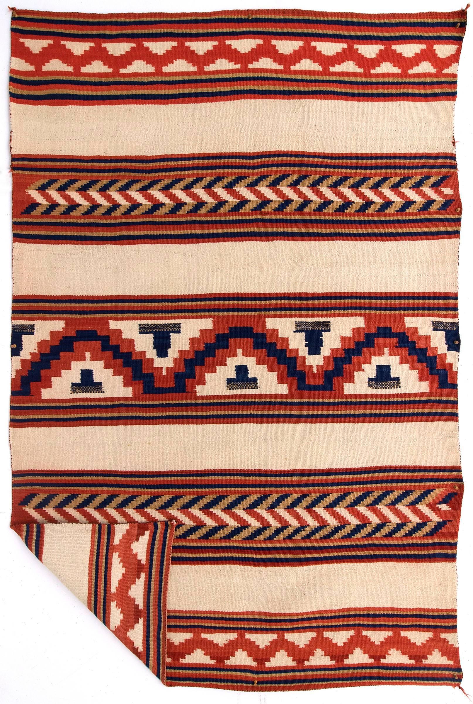 A late Classic period Sarape. This rare textile is woven of native hand-spun wool with natural indigo and aniline dye.

