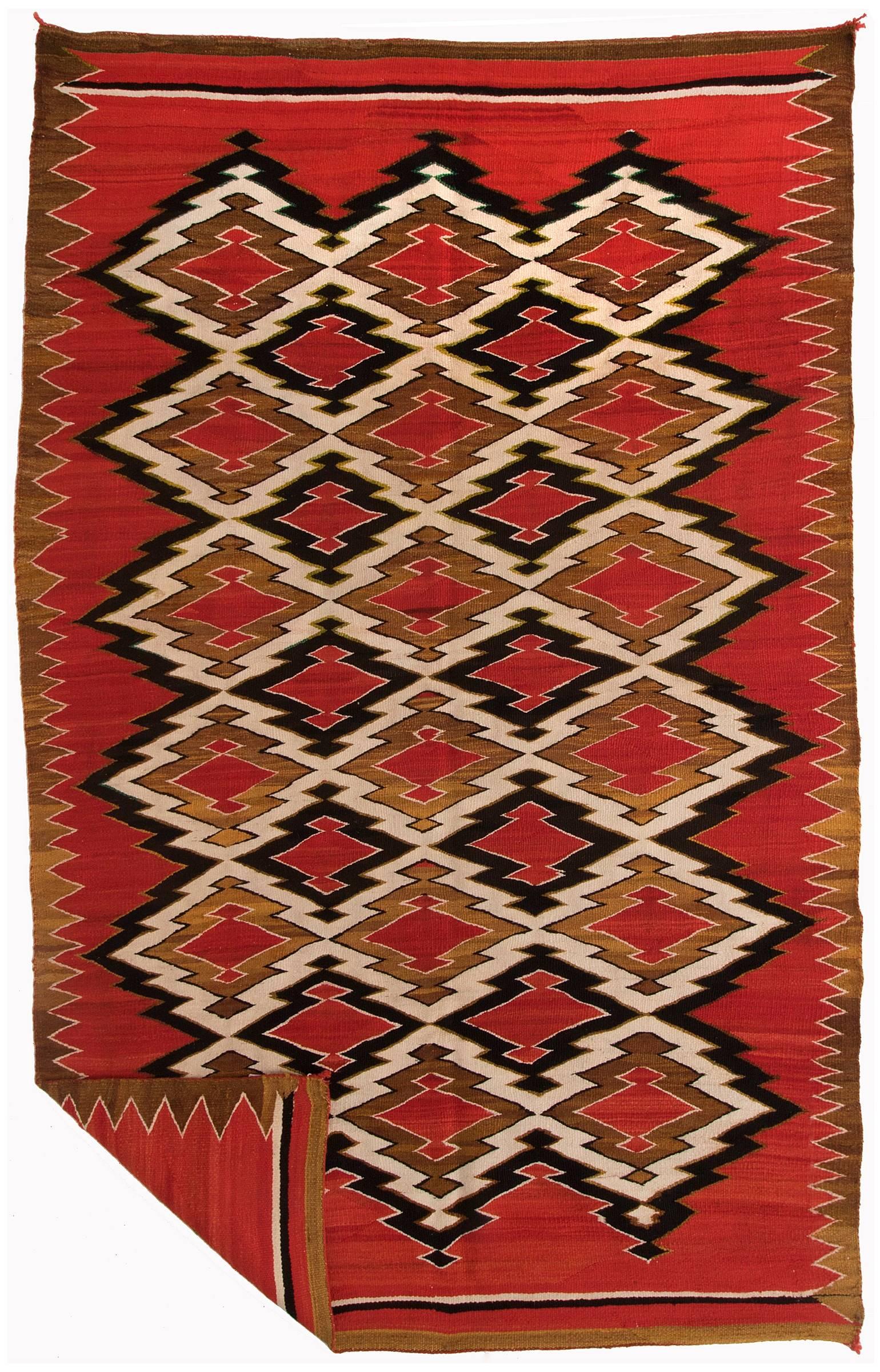 Woven of native hand-spun wool with natural fleece colors of ivory, brown and black. Aniline dyes were used to achieve the red color.

This textile is well suited for use as a wall hanging, coverlet or furniture throw.