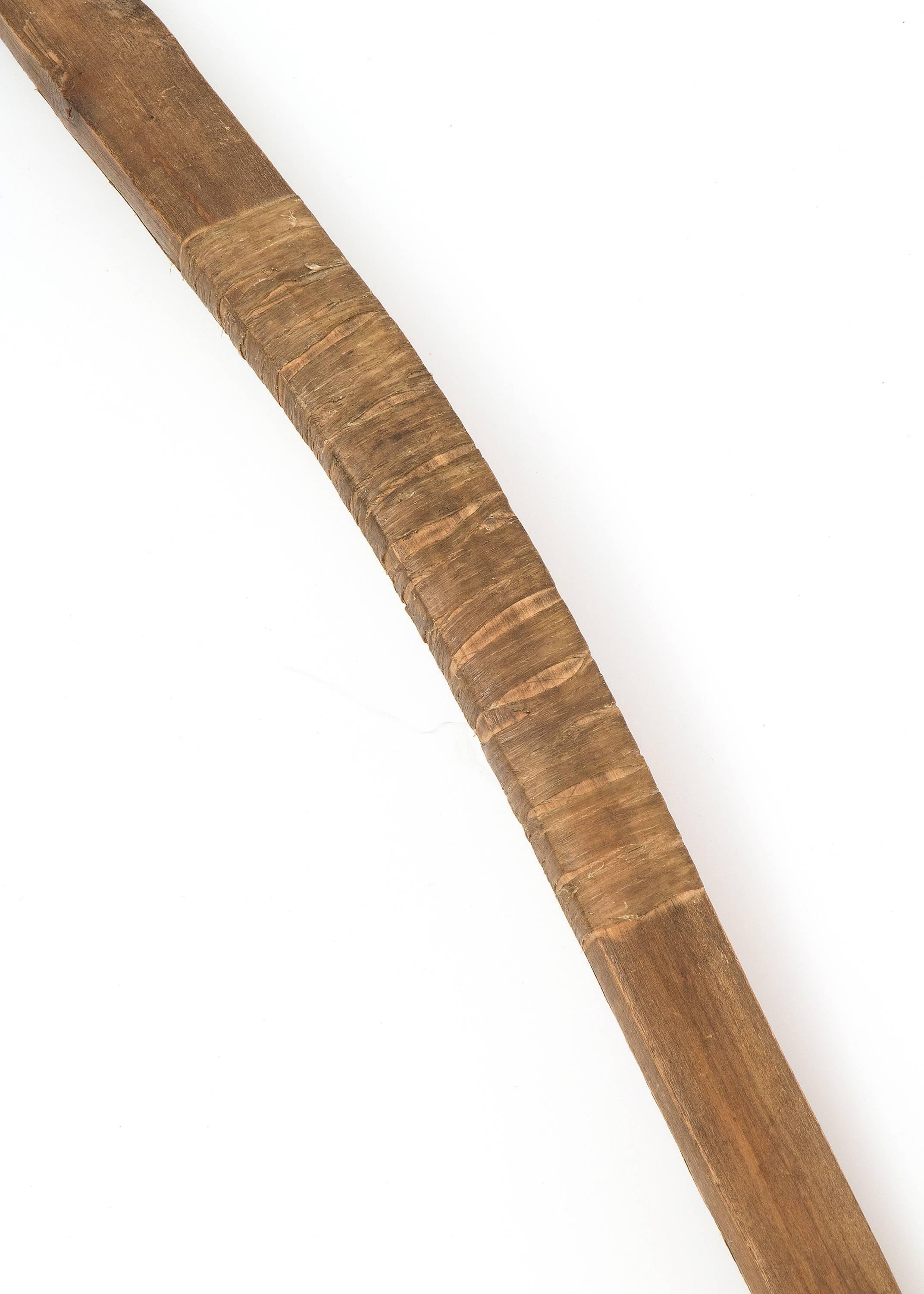 An authentic Plains (North American Indian) bow with pigment and sinew dating to the last quarter of the 19th century (circa 1875-1900).