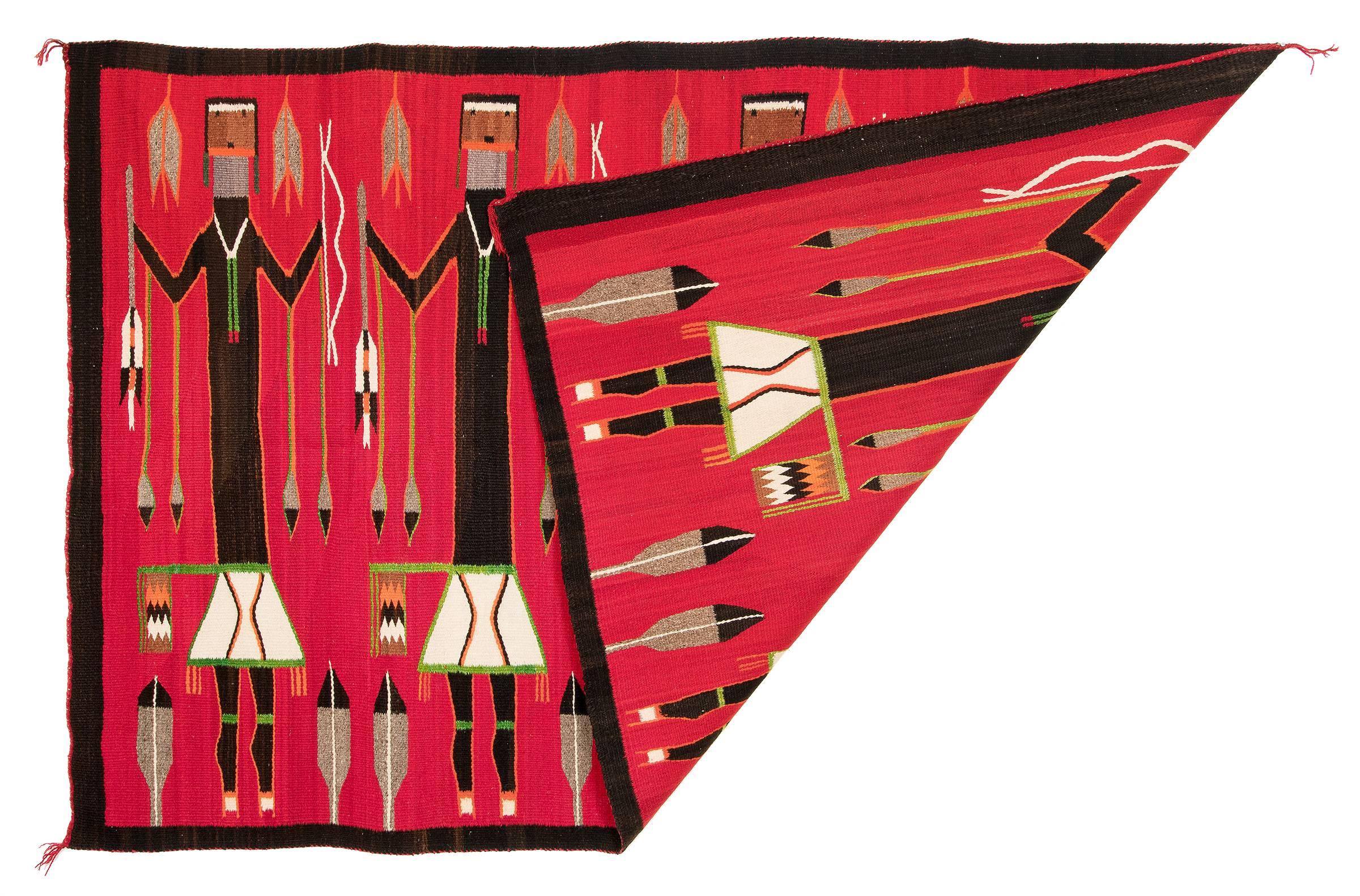 A pictorial weaving depicting four Yei figures with bows and arrows and feathers against a striking red background. Woven of native handspun wool in natural fleece coloring of ivory, gray and black with aniline dyed red, orange and blue.

The Yei