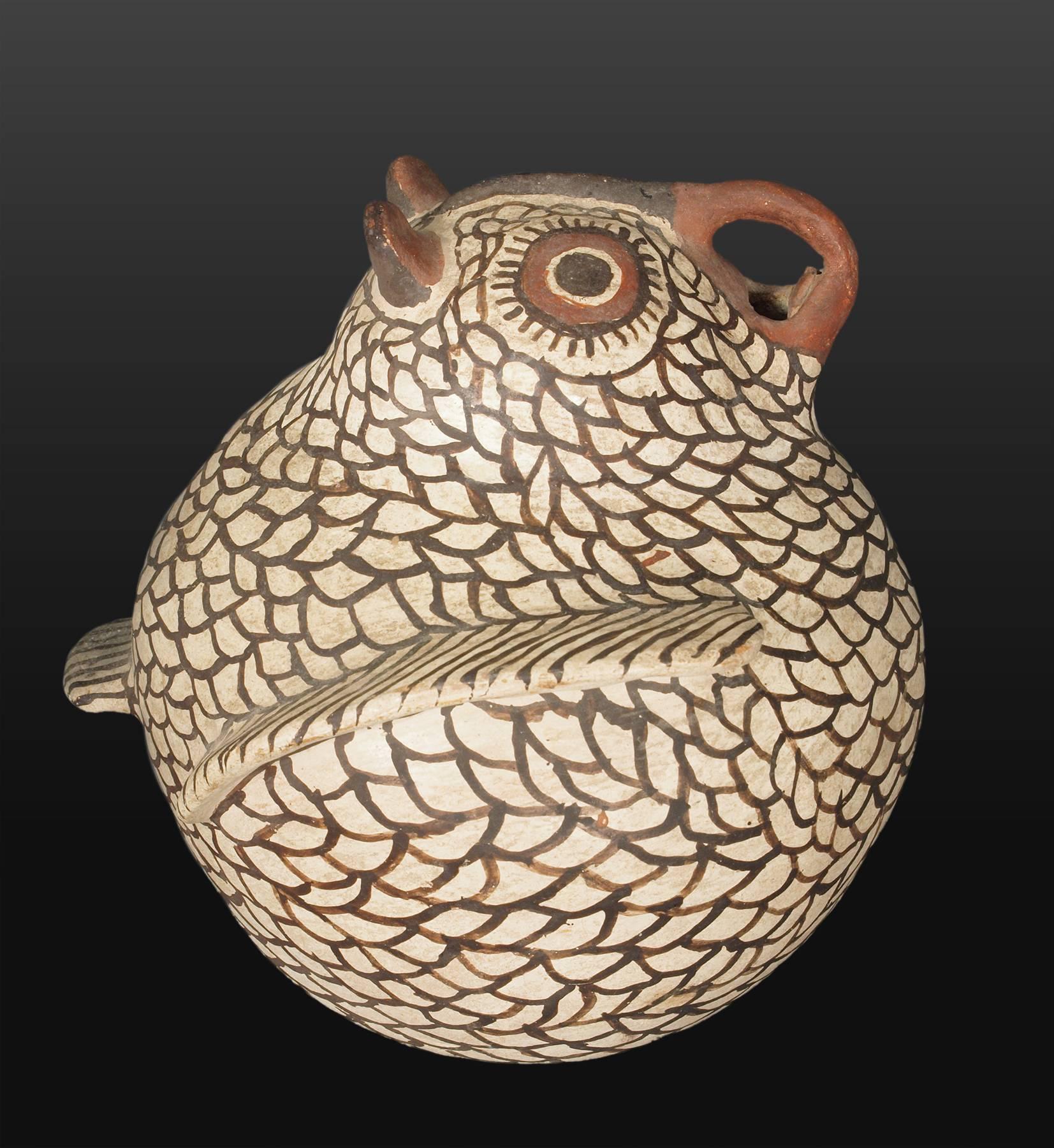 A Zuni (Pueblo Indian) polychrome pottery owl attributed to Nelli Bica (who was born around 1904). This is likely an earlier jar for her and is among the fine

expedited and international shipping is available, please contact us for an estimate.
 