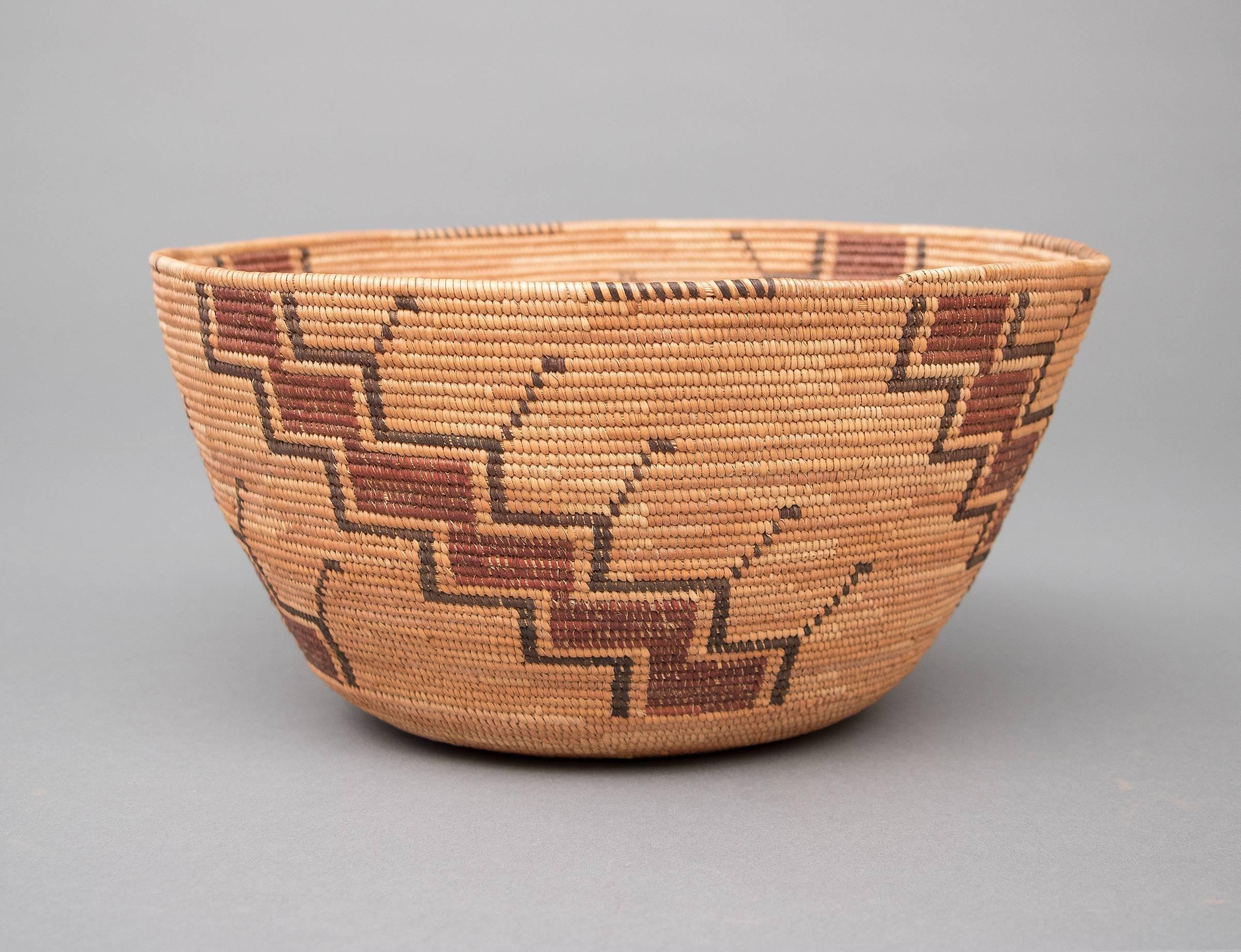 A polychrome basketry bowl with a geometric design. Expertly woven by a member of the Yokuts tribe which occupied the San Joaquin Valley of California, circa 1890.

Expedited and international shipping is available, please contact us for an