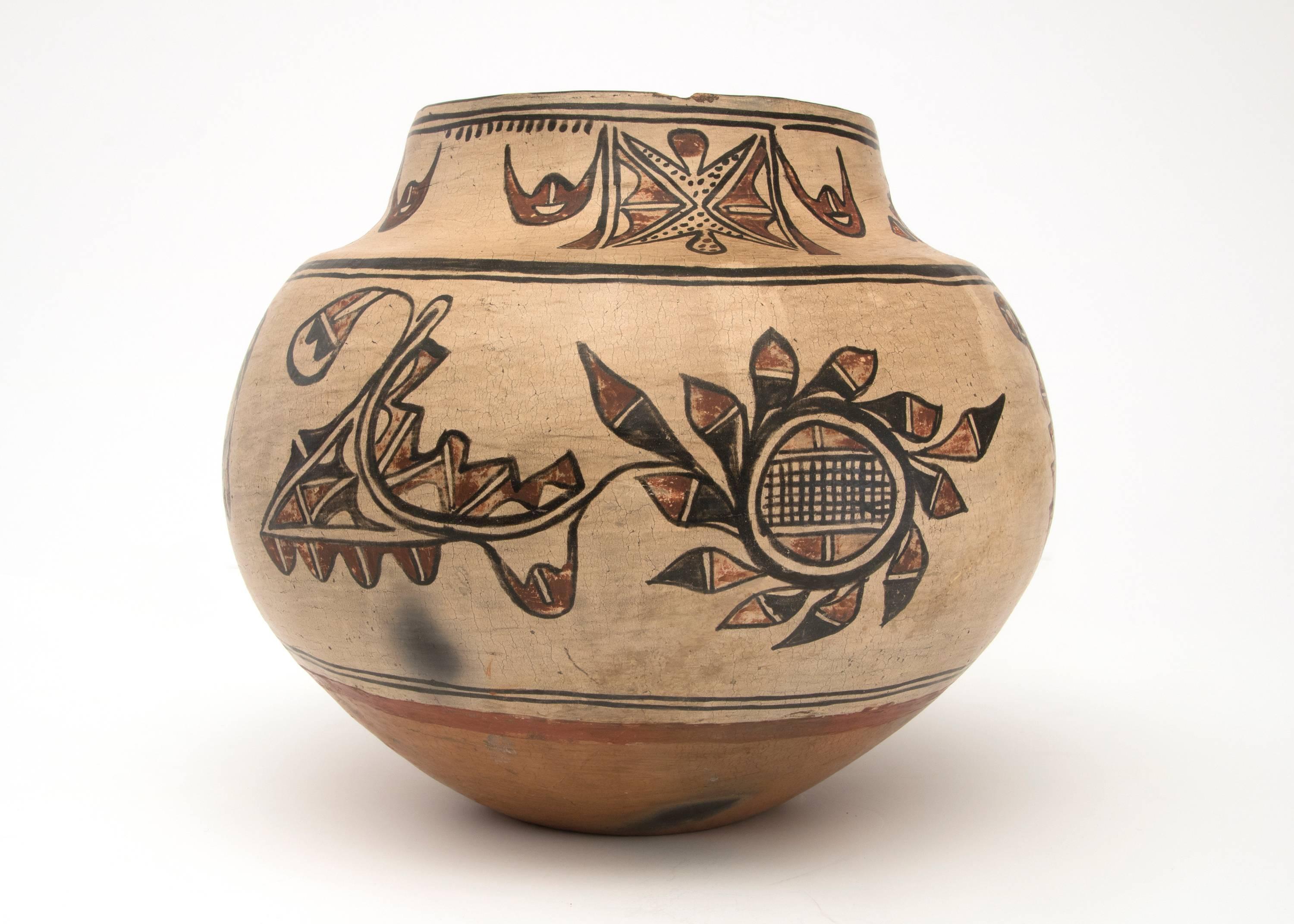 19th century Native American Southwestern Polychrome Pottery Jar created at San Ildefonso Pueblo in an olla form, circa 1875-1900. Constructed by hand and finely painted with slip glazes traditional designs. The Pueblo de San Ildefonso (