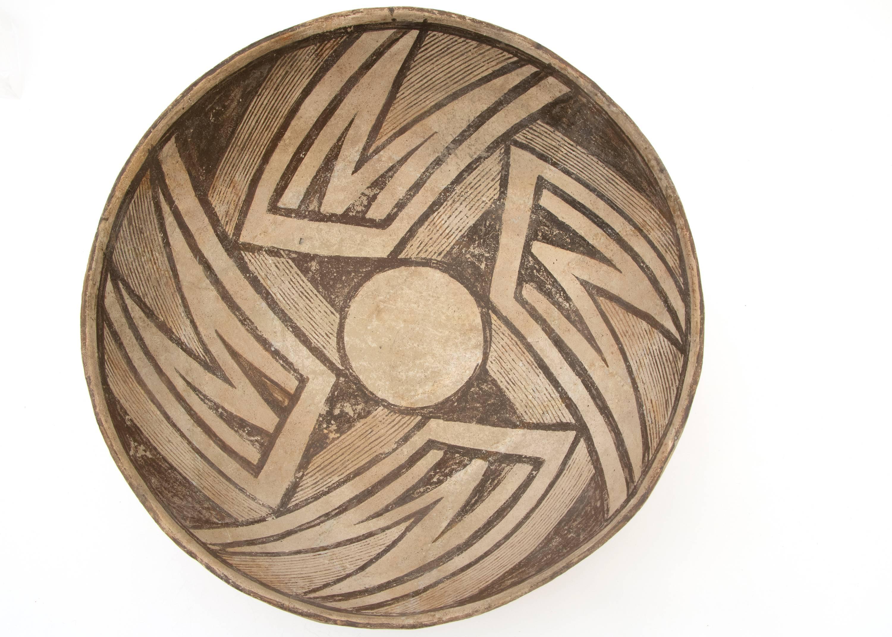 A Mimbres black-on-white earthenware bowl finely painted with slip glazes in a geometric pattern. 

The Mimbres, part of the Mogollon Culture of Pueblo Indians, lived in the Mimbres Valley including the upper Gila River and parts of the upper San