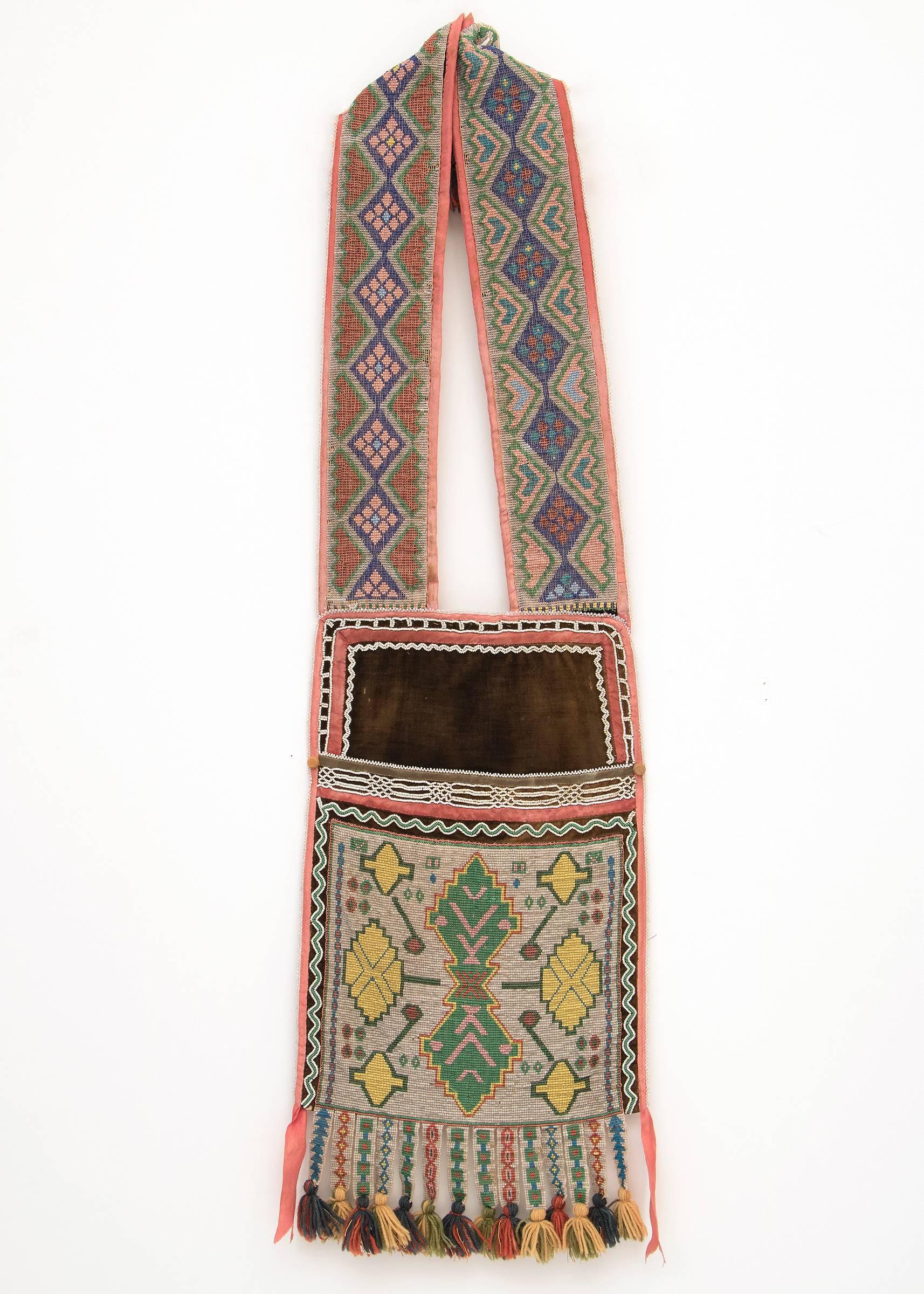 Overall dimensions as displayed are 37 x 23 inches.

Left:
Winnebago, circa 1870
measures 37 x 10.5 inches
An exceptional early bandolier bag created during the Classic period (Pre-Reservation) circa 1870 by a skilled Winnebago/Hochunk (Native