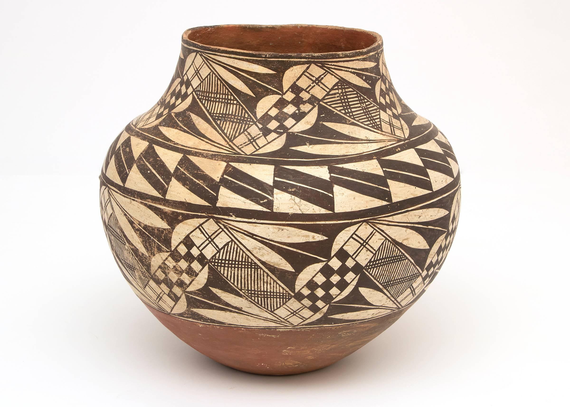 Collection of Southwest Ollas from the late 19th and early 20th centuries. Jars or Ollas such as these were used for carrying water and these were all built by hand from native clay and very finely painted with slip glazes. Overall dimensions as