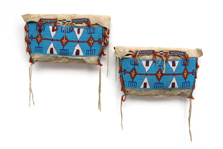 Sioux (Plains Indian) pair of antique beaded Possible bags, also referred to as 'Tepee/Tipi' bags. Constructed of native tanned hide, sinew sewn with trade beads. Custom wall mount display stands are included.   Part of the Plains Indian culture