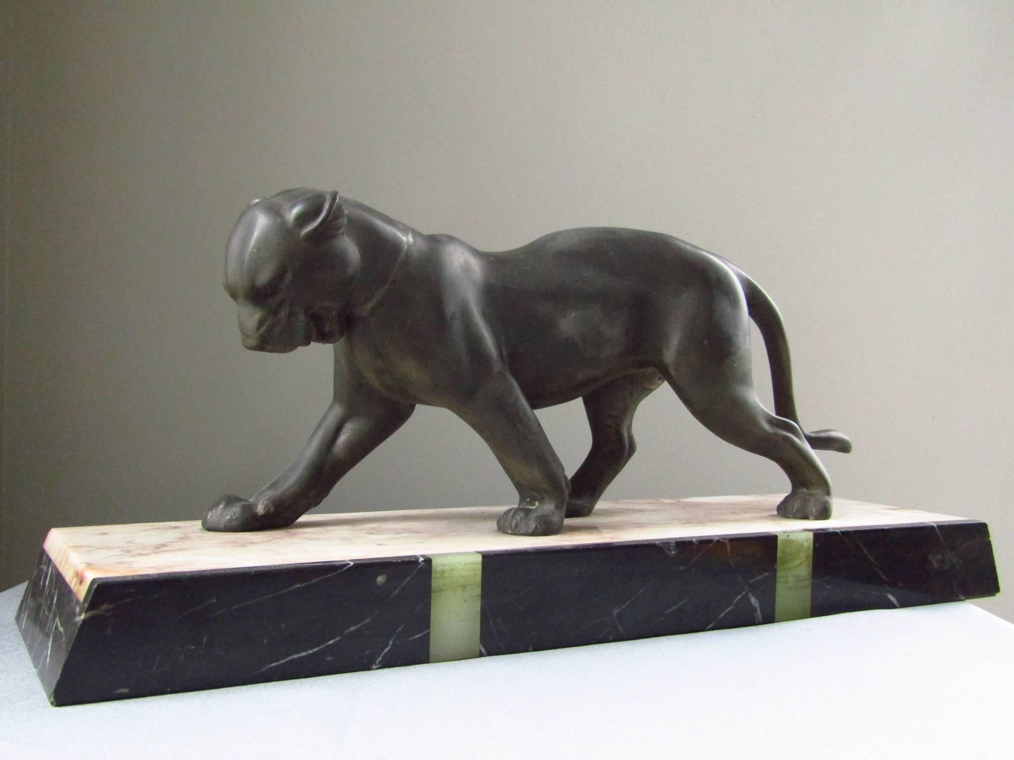 Art Deco walking panther sculpture on multi-color marble base, France, 1935 made of patinated regule.

Worldwide free shipping of this item!