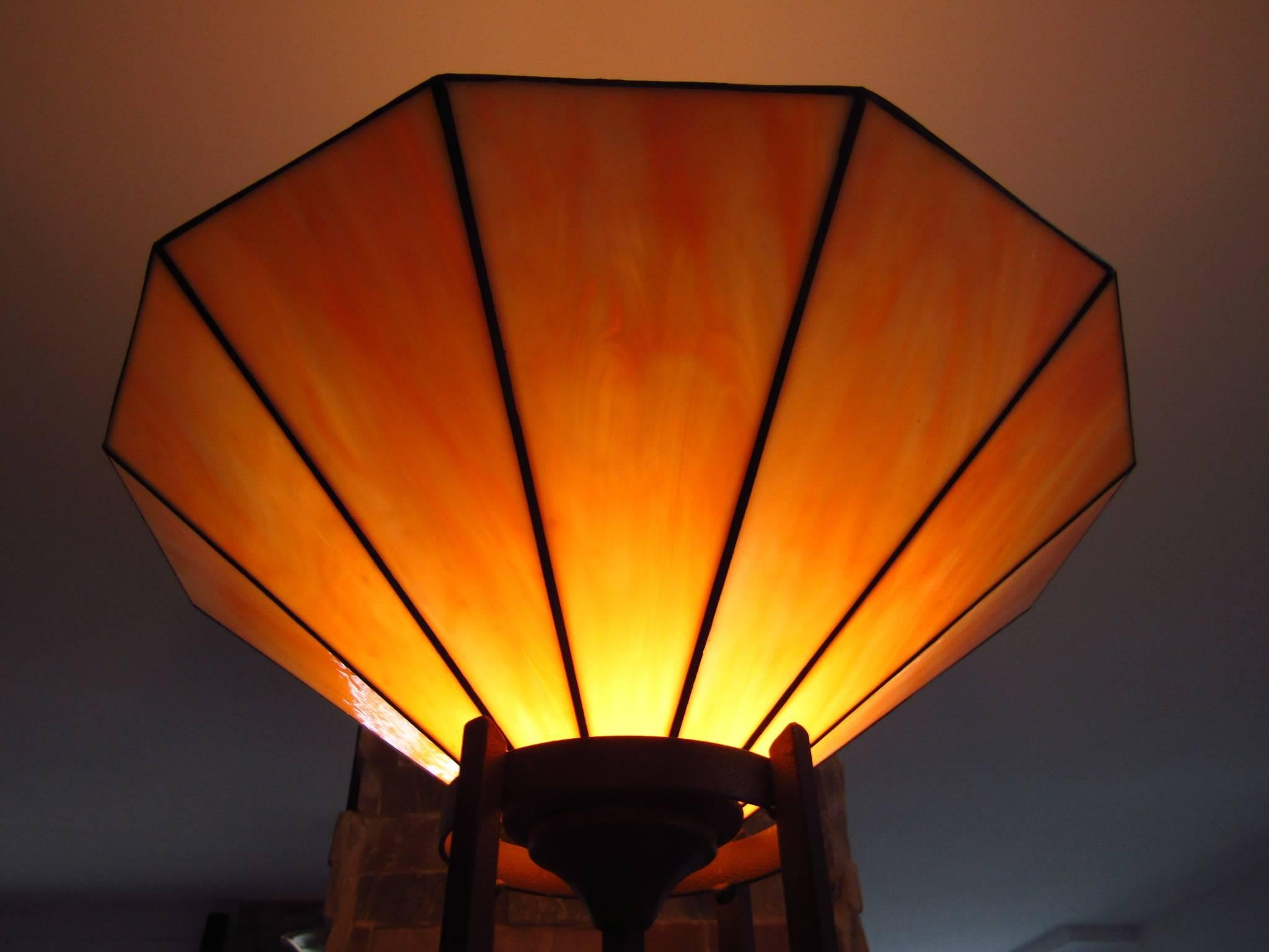 French late Art Deco torchiere with Tiffany style glass. Iron base. Gives a very warm yellow light!

We offer door to door shipping! Please ask for your quote.
