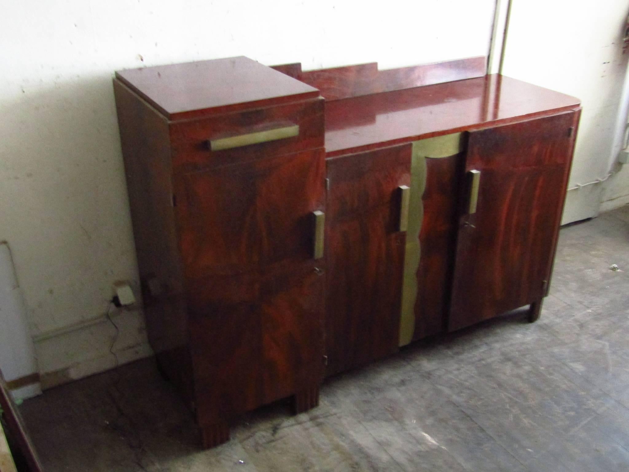 Mahogany Art Deco sideboard, France, 1935. Bronze details.
Unrestored original condition, needs new surface.

*** We offer door to door shipping. Please ask for your quote! ***
 