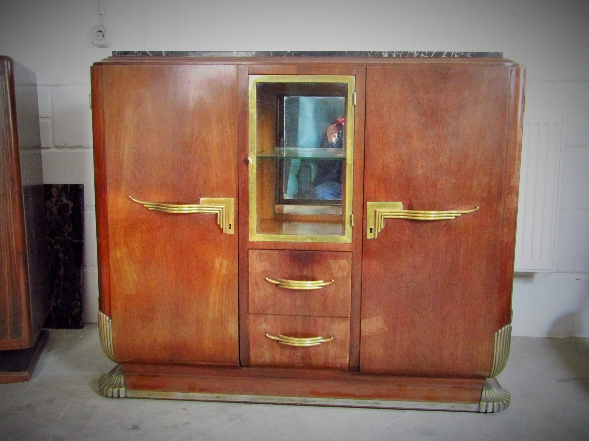 Rosewood Art Deco showcase sideboard, France, 1935. Bronze details. Original marble. Unrestored original condition. Needs new surface.

We also offer the matching second sideboard.

We offer door to door shipping. Please ask for your quote.