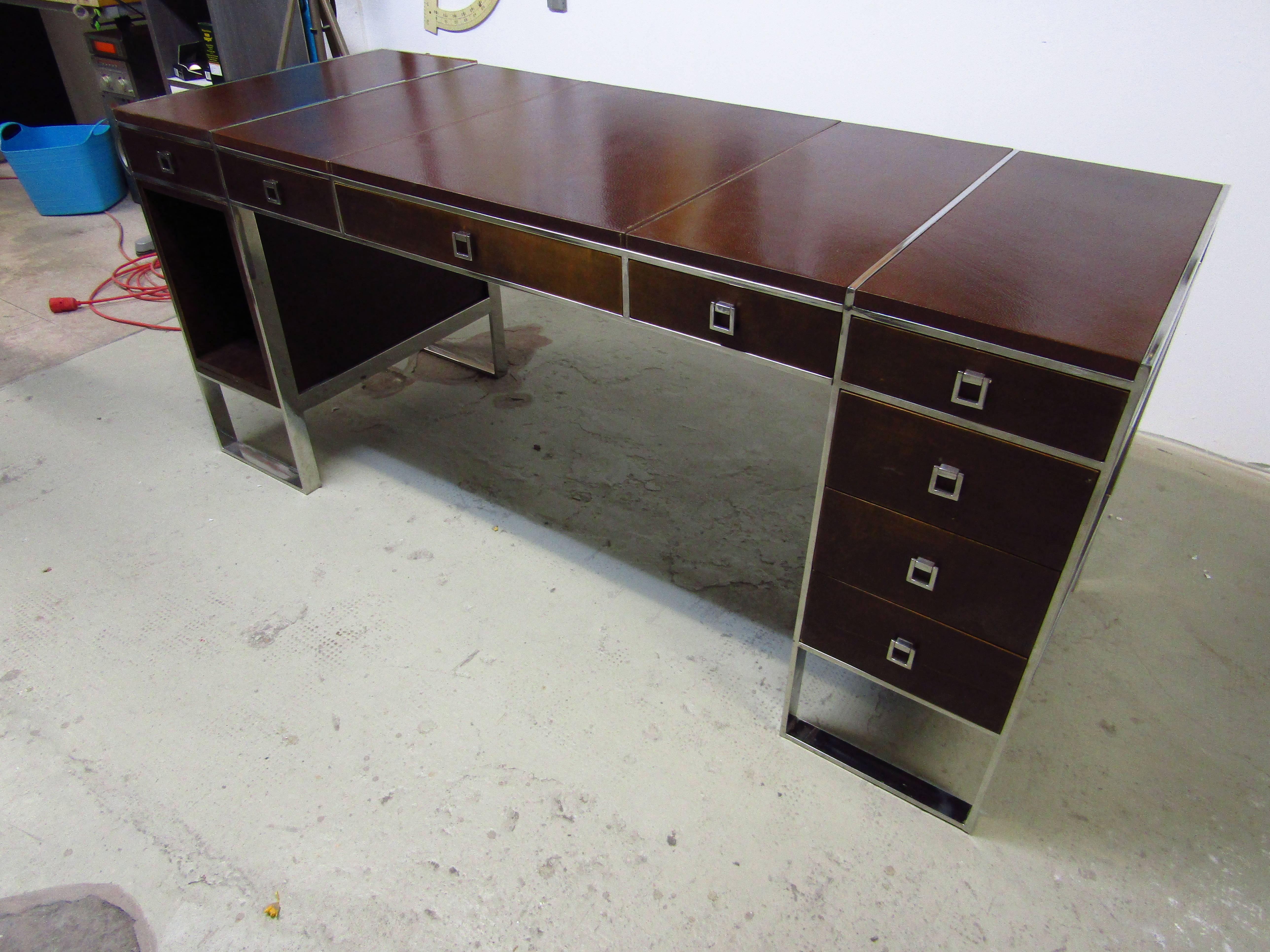 Midcentury Desk by Guy Lefevre for Maison Jansen, France, late 1960s. Good original condition. Chrome in very good condition. Front side with eight drawers. Top coated with embossed genuine leather.

Could also be used as console!

