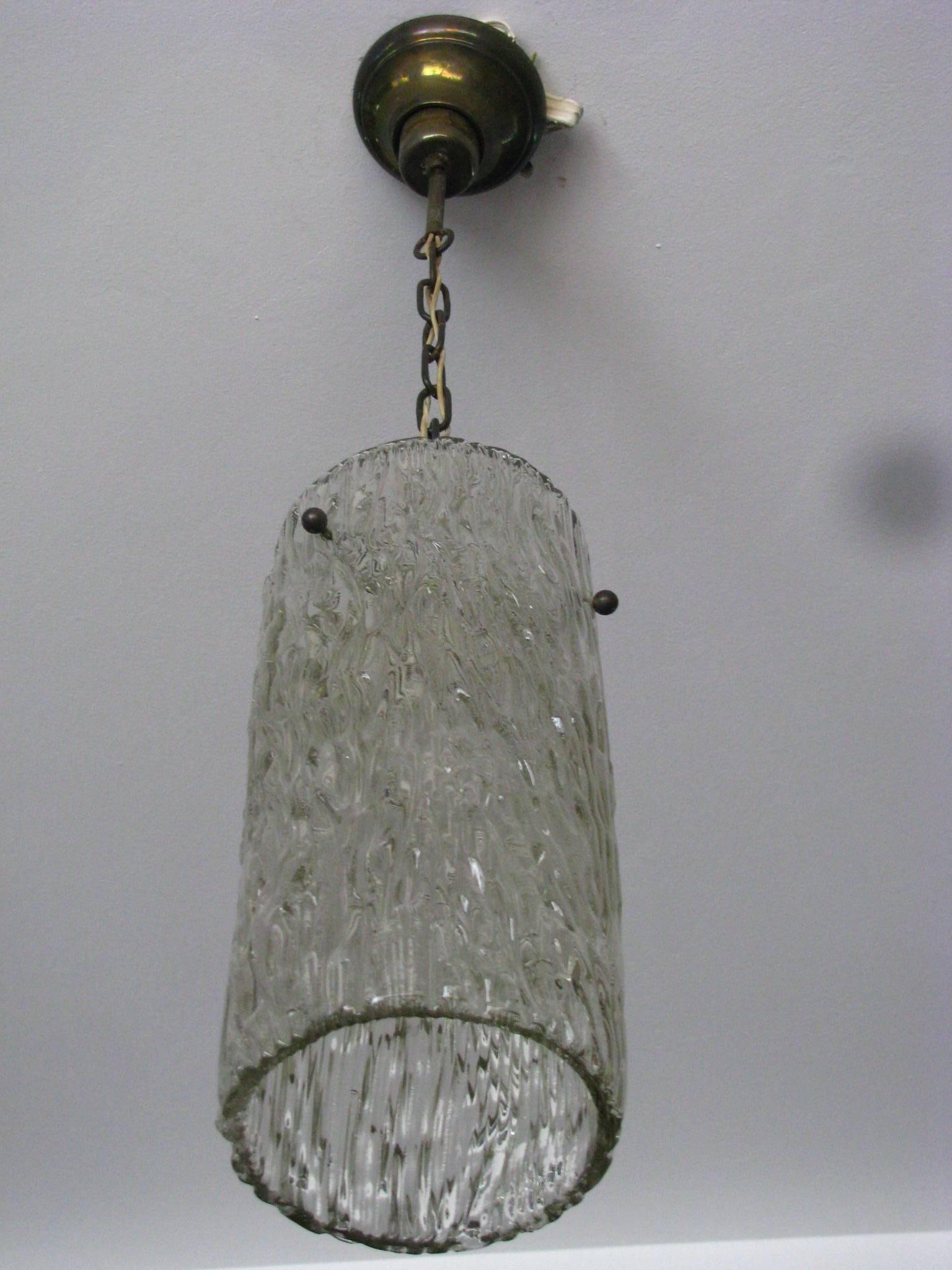 Midcentury ice glass pendant by Kalmar. Perfect vintage condition.

Measurements:

Height 33.5 in. (85 cm)
Diameter 6.3 (16cm).

Note: Nice light effects when dimmed!

 