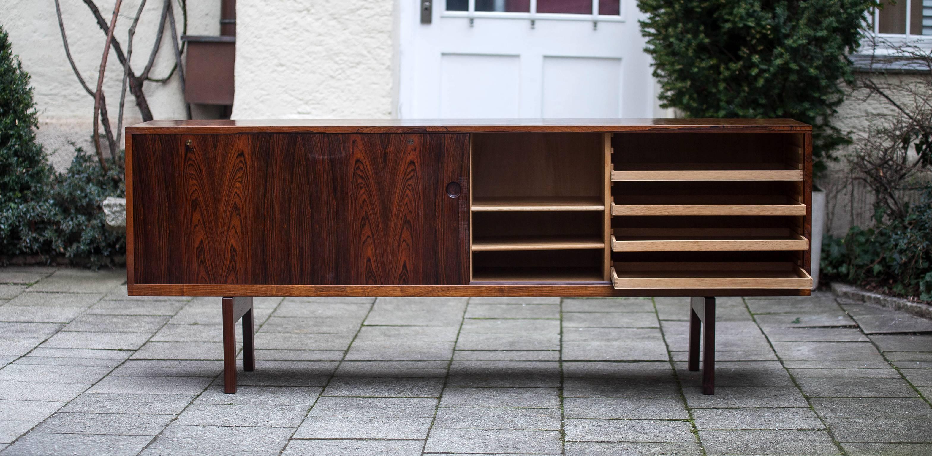 Fantastic rosewood sideboard designed by Hans Wegner for Ry Mobler.
The sideboard is signed with Danish Furniture control mark.