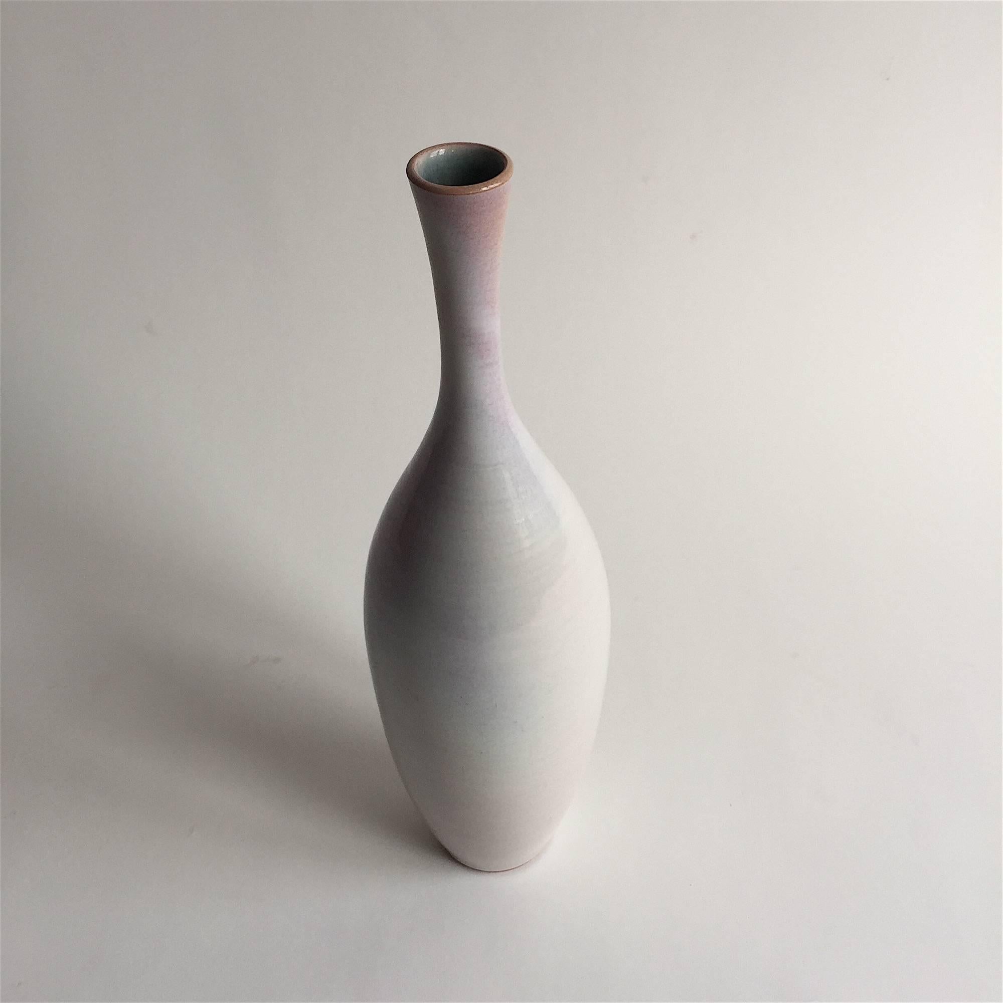 Suzanne Ramié (1907-1974,) France.

Ceramic vase by renowned France artist Suzanne Ramié having a white-purple glaze. Vallauris red Clay. Incised on the bottom with the artist's 