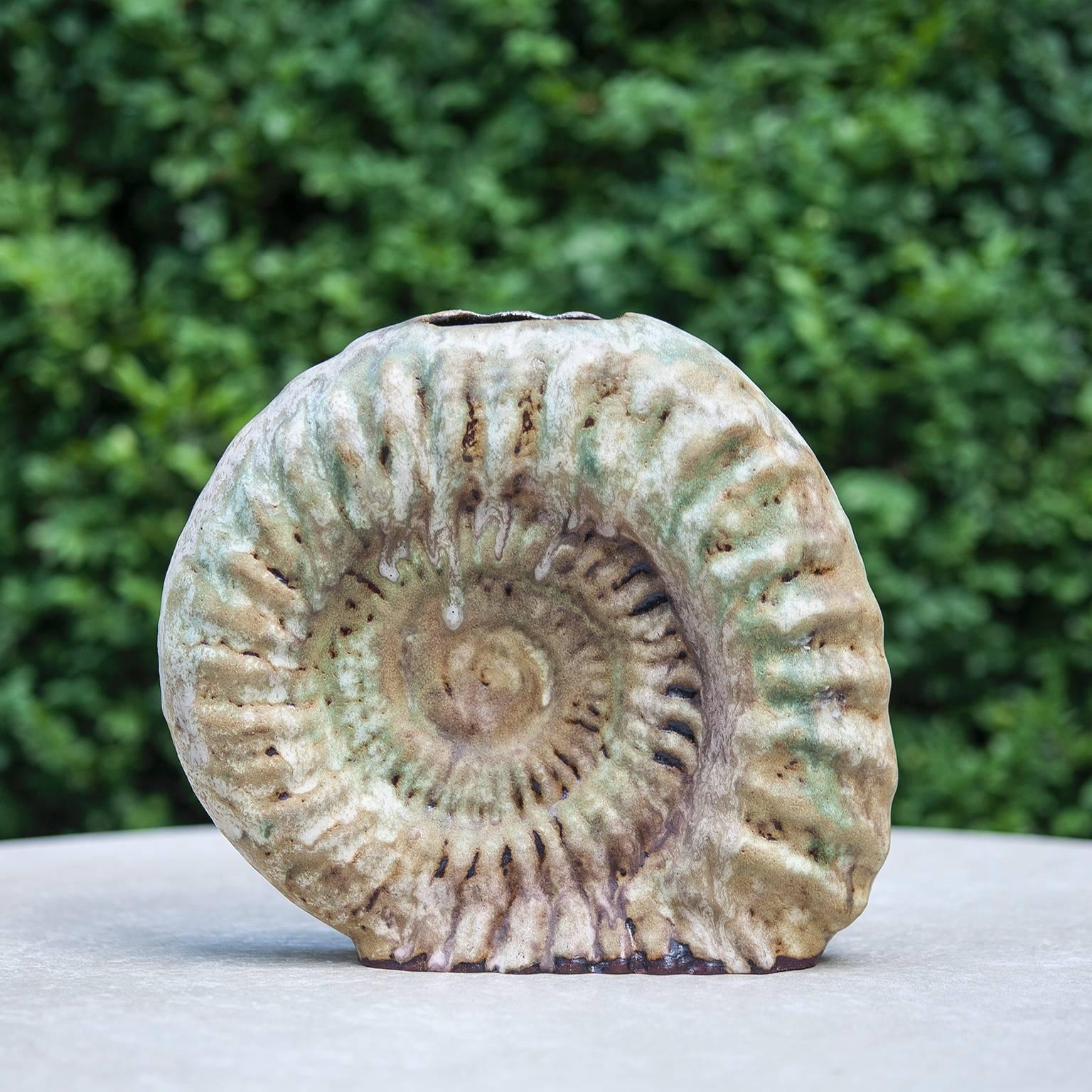 Helmut Schaeffenacker German art pottery / studio ceramic vase, beautiful object in the style a fossilized ammonite and unique piece with artist label.
Helmut Schäffenacker (1921-2010) was a renowned and prolific German ceramic artist, recognized