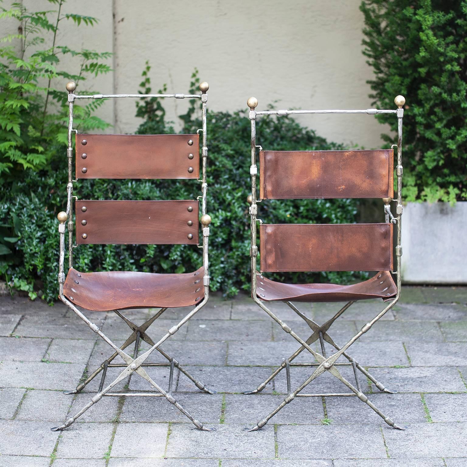 Beautiful Maison Jansen folding chairs with armrest in nickel iron base and brass balls, copper nits and brown thick leather, France, 1968.