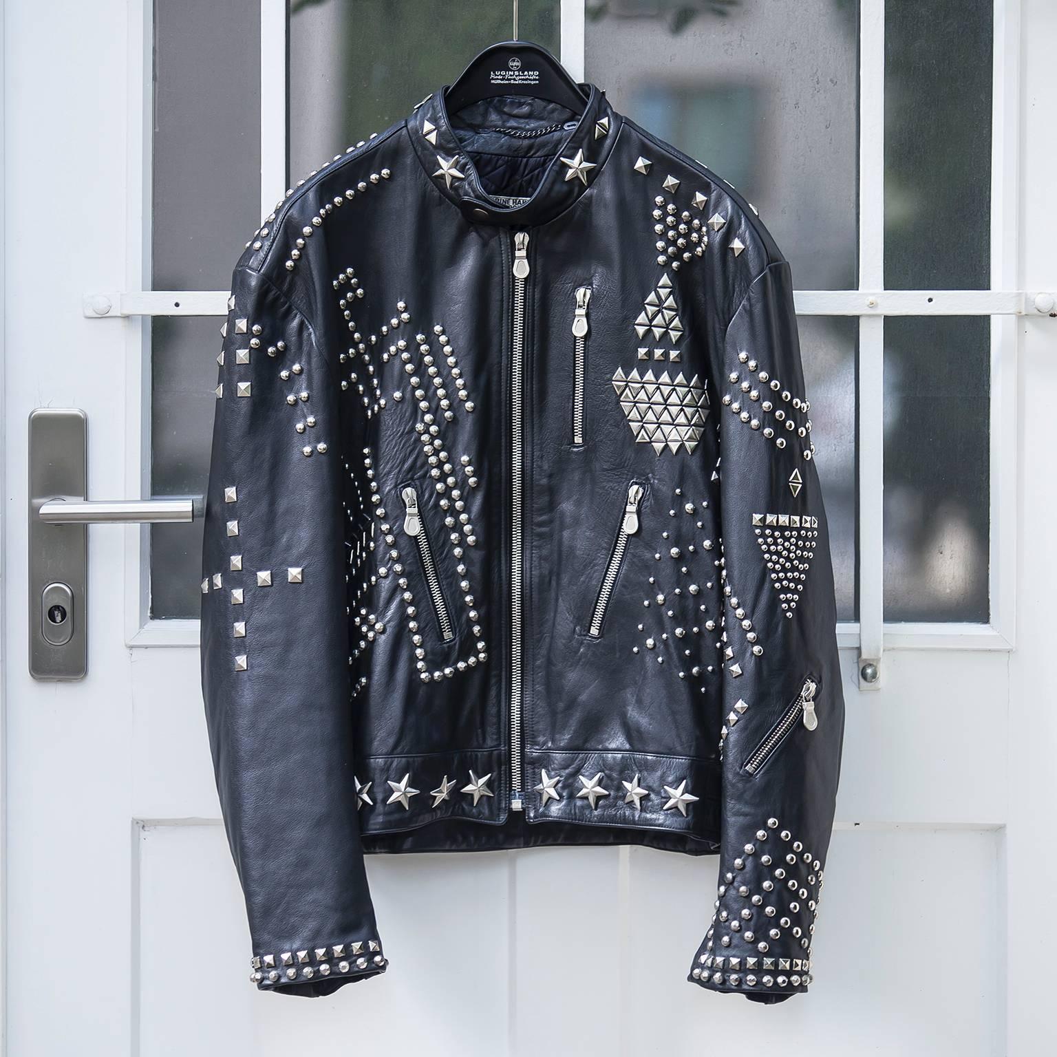 Katherine Hamnett clean up or die man leather jacket, 1989.
Studwork embellishes the entire surface of this black leather jacket from Katherine Hamnett’s Winter 1990 ‘Clean Up or Die’ collection. Hexagonal facetted studs and round studs are riveted