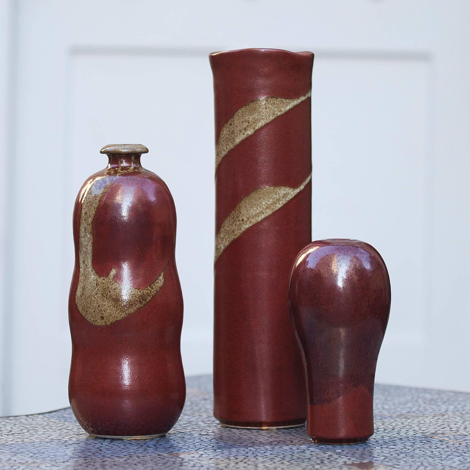 Beautiful set of Horst Kerstan ceramic in red and golden glazed ceramic from the 1970s. Horst Kerstan (1941-2005) made a crucial impact on post-1945 German ceramics. The artist, who is renowned at home and abroad, began his career with an