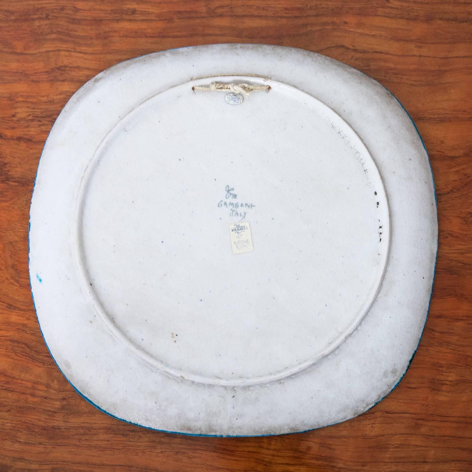 Huge Guido Gambone, polychrome earthenware plate, signed with Gambone and the Donkey Mark.
Measures: H 3.8, B 40, D 40 cm.