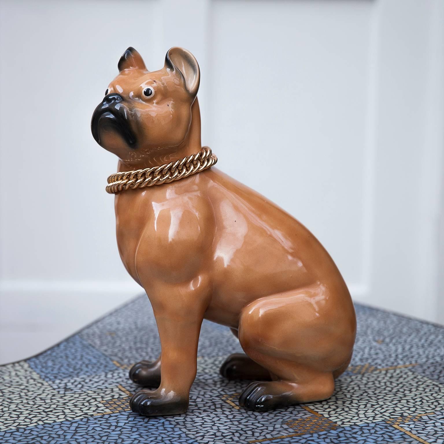 French bulldog figure by Piero Fornasetti in glazed porcelain and gold metal chain, Milan, Italy, retailed by Anita Kott from 1970s
The figure wears a gold, metal neck chain, with two Fornasetti Milano marks on the base.
H 39, B 15, D 22.5 cm.