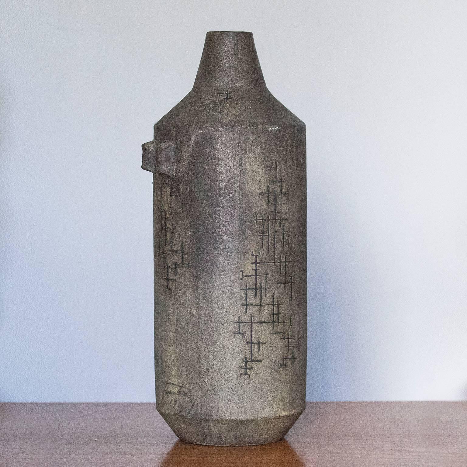 A tall and important unique studio vase in grey green ceramic by Marcello Fantoni, Florence, Italy, (1915-2011). 
Hand-built earthenware with rough, matte grey glaze signed on the side Fantoni 1961. Directly acquired from the artist by an Italian
