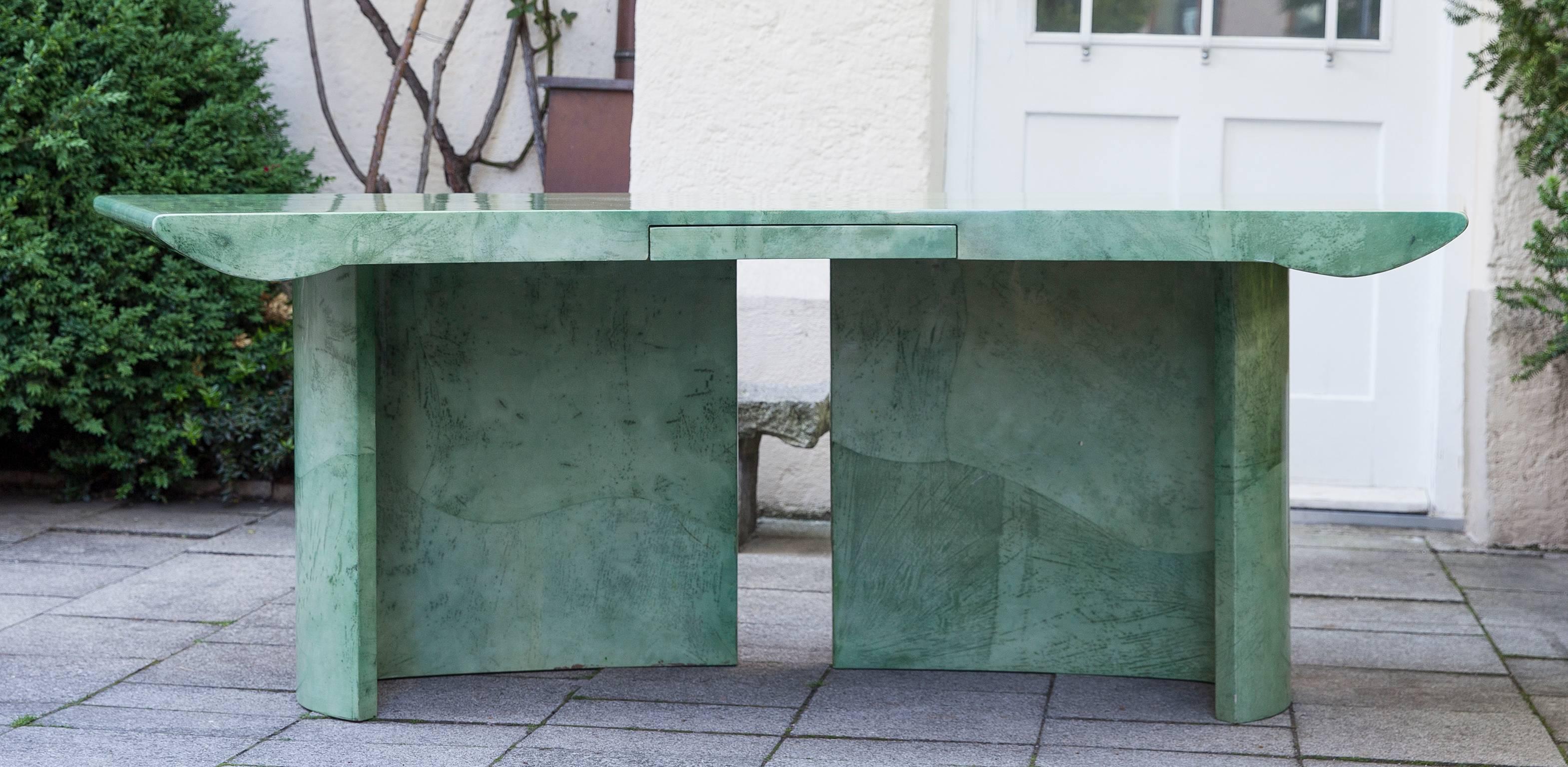 Wonderful Aldo Tura modern style mint green desk in asymmetric shape from Italy, 1980s.

Measures: H 75 x W 220 x D 100 cm.