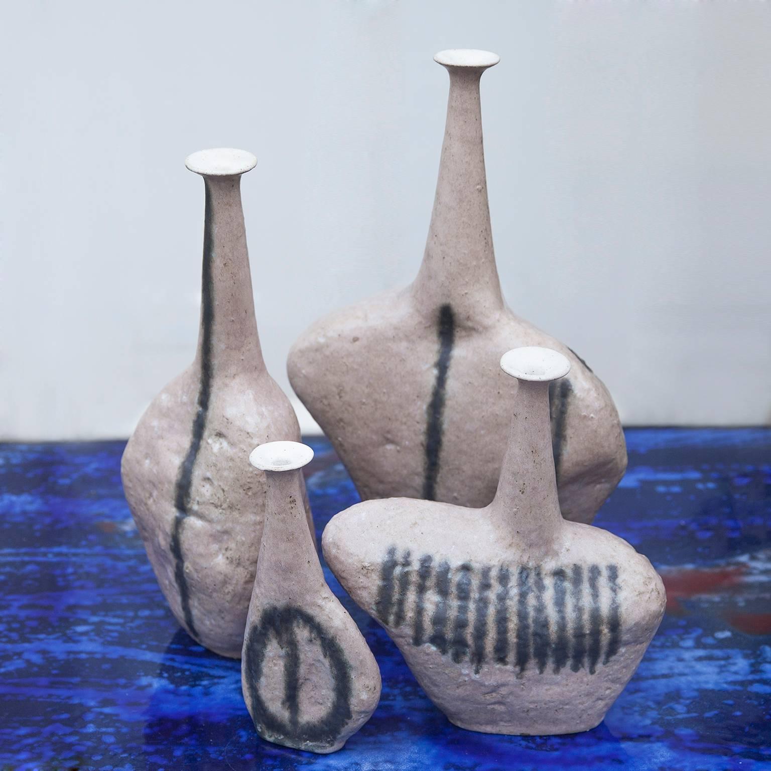 Very rare and huge set of four unique stoneware vases model Sassi by the famous Italian Artist Bruno Gambone in grès light rose glaze and fantastic forms, directly bought from the Artist, signed Bruno Gambone Italy.
The dimensions are H 50x W 33 x