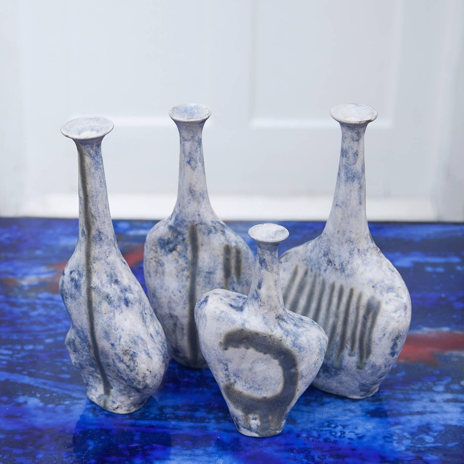 Very rare and unique set of four unique stoneware vases model Sassi by the famous Italian Artist Bruno Gambone in light blue grey glaze and fantastic forms, directly bought from the Artist, signed Bruno Gambone Italy from 1984.
The dimensions are H